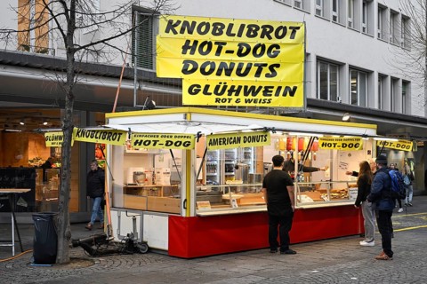 Take-away garlic bread, hot dog, donuts and mulled wine