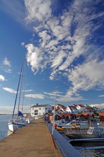 Leisure boats and small harbour and a small island built with wooden houses, Bohuslän, Sweden