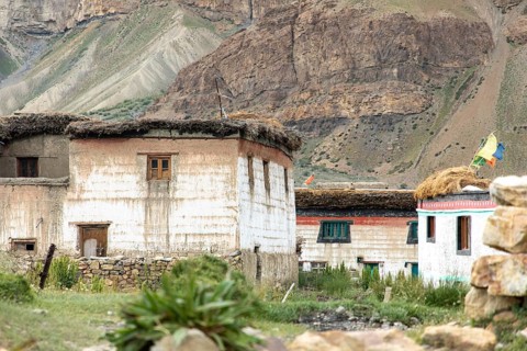 Traditional houses with flat roofs and natural materials sit quaintly in Spiti Valley, India,