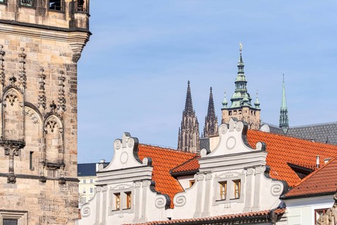 A beautiful view of Prague's historic architecture, featuring detailed Gothic towers and