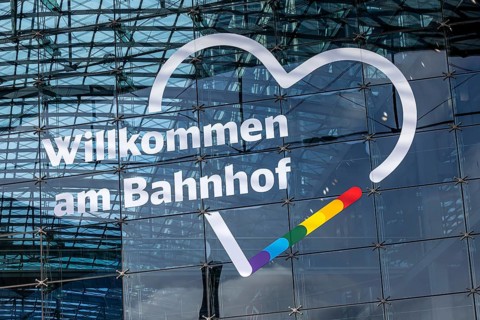 Berlin Central Station. Glass façade with Deutsche Bahn AG logo. Welcome to the train station.