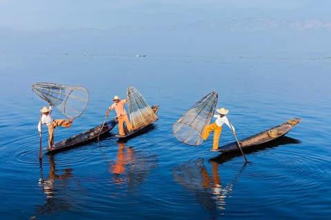 Myanmar travel attraction landmark, Traditional Burmese fishermen balancing with fishing net on
