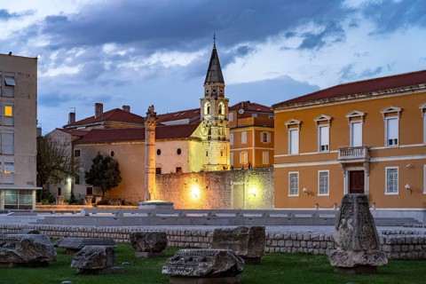 The Pillar of Shame and the Orthodox Church of St Elias in Zadar at dusk, Croatia