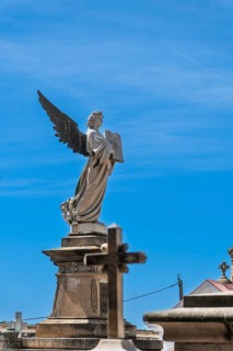 Angel on a tomb in a cemetery in Barcelona, Spain