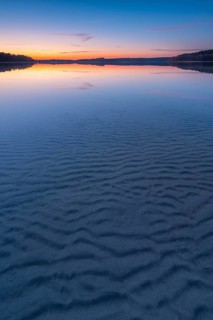 Lake Fürstensee, clear water with wave structure in the sand, sunset, Müritz National Park,