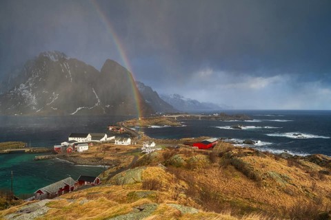 Thunderstorm atmosphere and rainbow over the islands Sakrisøy and Hamnøy, Reine, Moskenesøya,