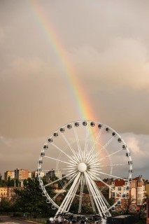 Ferris wheel with rainbow near the Philharmonic Hall in Gdansk, Poland