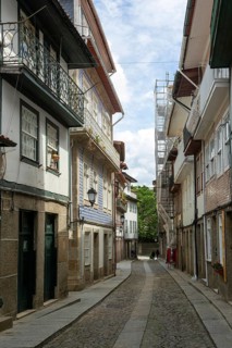 Street of historic buildings with balconies, Rua Egas Montiz, city centre Guimaraes, northern