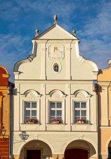 Renaissance-reconstructed Gothic house with high gable and sundial remodelled in the Baroque style