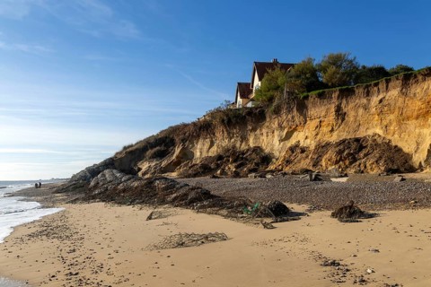 Clifftop houses at risk from coastal erosion, Thorpeness, Suffolk, North Sea coast, England, UK