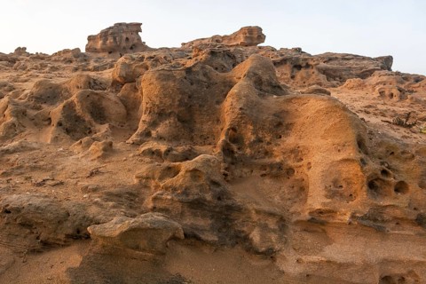 A rocky area with a hole in the ground. Rabat, Morocco