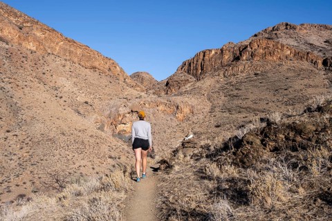 Female hiker on the Olive Trail, Naukluft Mountains, Namib-Naukluft Park, Hardap, Namibia