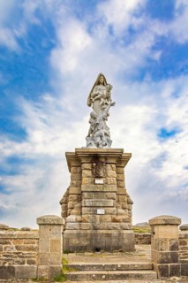 Notre-dame des naufragés sculpture at Pointe du raz with a scenic cloudscape view Finistère.,