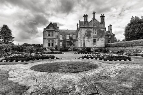 Manor house with gardens, Muckross House & Gardens, dramatic cloudy sky, monochromeKillarney