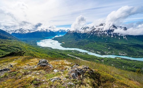 View of snowy mountains and turquoise lake Kenai Lake, Slaughter Ridge Trail, Cooper Landing, Kenai