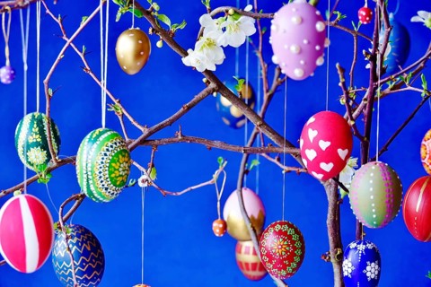 Easter, Easter bouquet with colorful Easter eggs, branches with flowers of an ornamental quince,