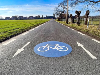 Large marking on narrow district road country road in rural area painted symbol for road signs 244
