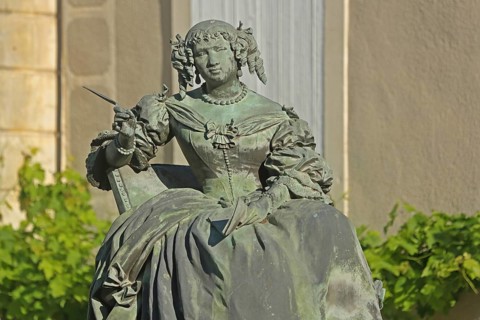 Monument with sculpture of Marquise de Sévigné, Madame, French, aristocracy, noblewoman, seated,
