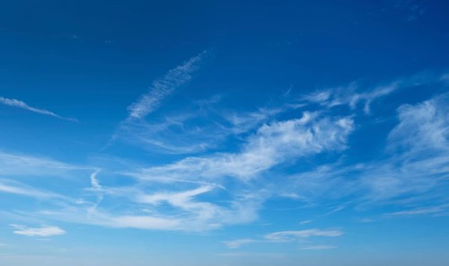 Clear Blue Sky with Wispy Clouds on a Sunny Day - Nature, Weather, and Serenity