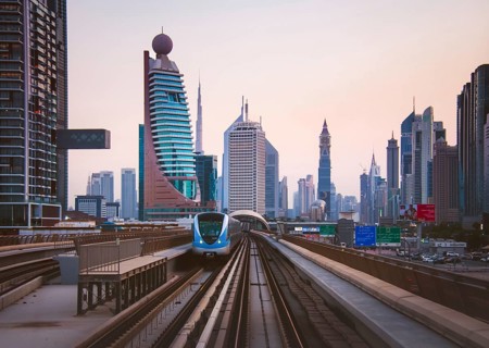 Dubai, UAE - 10th october, 2022: metro arrives to metro stop in city of Dubai with scenic modern