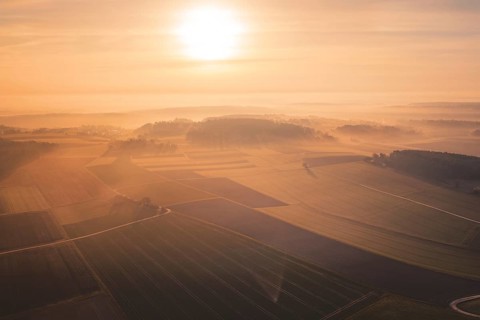 View of vast fields and forests in foggy sunrise, Gechingen, Calw district, Germany