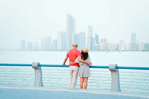 Caucasian tourist romantic couple stand together enjoy skyline panorama on scenic viewpoint in Abu