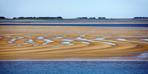 Schleswig-Holstein Wadden Sea National Park at low tide with sandbanks and mainland, North Frisia,