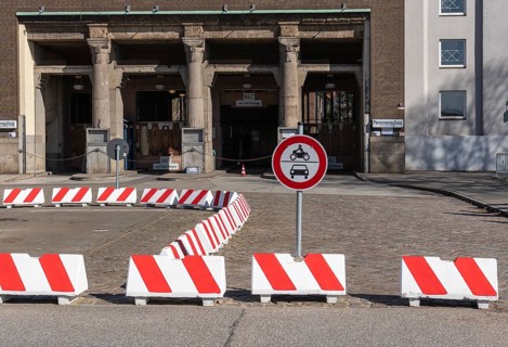 Red and white road barriers at the entrance to the Old Elbe Tunnel in Steinwerder, Hamburg, Germany