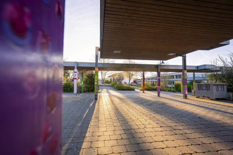 Sunny evening at a schoolyard with long shadows on the pavement, Schlehengäuschule, Gechingen,
