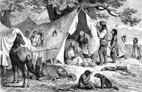 Group of people with no fixed abode, Sinti and Roma, camp in the shelter of a tree, woman preparing