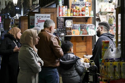 Syrians shop at the historic Al-Hamidiyah Bazaar adjacent to the Umayyad Mosque during the early