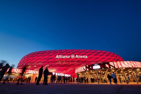 Visitors, fans, entrance area of the Allianz Arena, illuminated, overview, blue hour, in front of a
