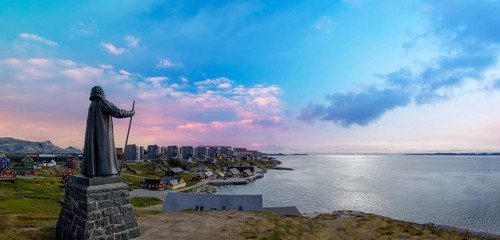 Panoramic view of Greenland capital Nuuk with colored houses located near fjords and icebergs