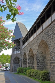 Historic town wall with defence defence tower built in the 15th century, battlements, town