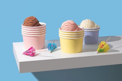 A minimalist presentation of chocolate, strawberry, and vanilla ice cream. The bright colors and