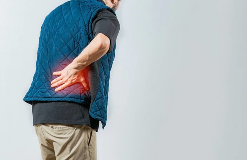 Person with pain holding his lower back isolated. Male person with spine problems, Lumbar problems