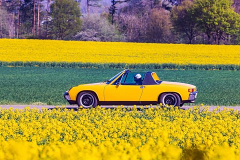 Travelling on a country road in the Swabian Alb with a VW Porsche 914 Youngtimer convertible,