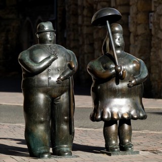 Bronze sculptures entitled Man with stick, Woman with umbrella by Fernando Botero, Goslar, Lower