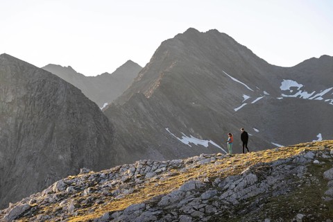 Hiker enjoying the mountain panorama in the morning, Venedigergruppe, Hohe Tauern, Austria