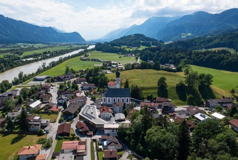 Drone image, view of village with parish church, Breitenbach am Inn, Inntal, Tyrol, Austria