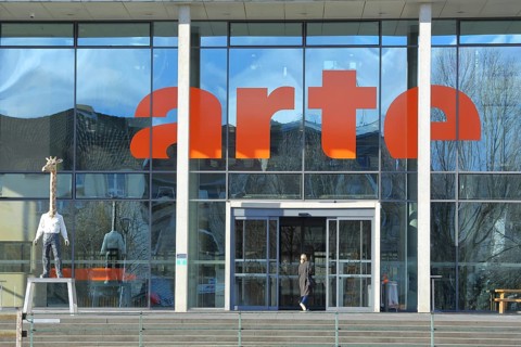 Entrance to the modern building of the broadcasting station Arte of ARD and ZDF with sculpture