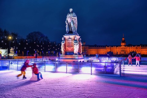 Ice skating rink on Schlossplatz, Karlsruhe Castle in the background, Karlsruhe, Baden-Württemberg,