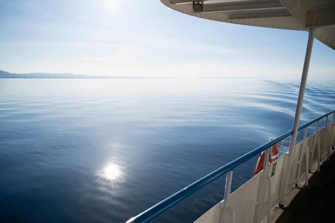 View from a ferry, boat, of water, waves, Bregenz, Vorarlberg, Lake Constance, Austria