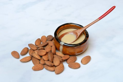 White almond cream in small bowls, almond butter