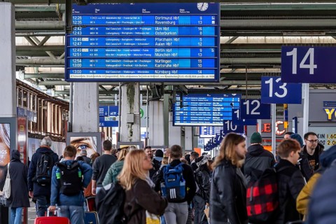 Travelers in Central Station, Passengers and Departure Board at Stuttgart Central Station,