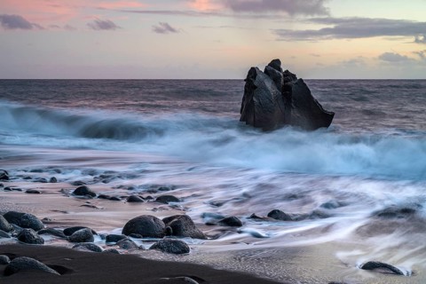 Sunset, waves and rocks in the sea, Praia Formosa, Madeira, Portugal