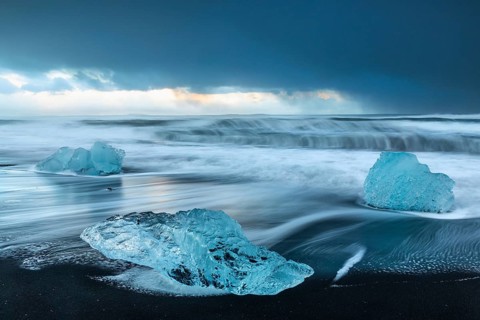 Ice chunks on the black beach, lava beach, glacier ice, sea, winter, sunset, Diamond Beach