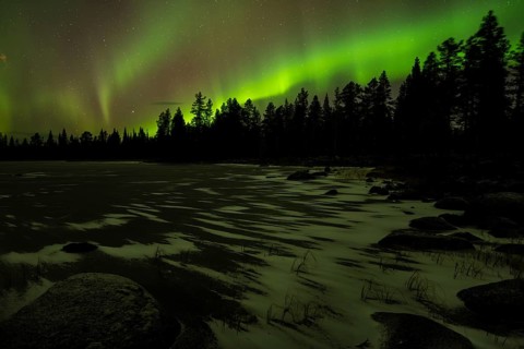 Northern Lights (Aurora borealis) over a frozen lake, Norrbotten, Lapland, Sweden, October 2022