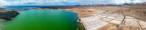 Salt mining plant, Salinas de Janubio with green Laguna de Janubio, near Yaiza, aerial view,