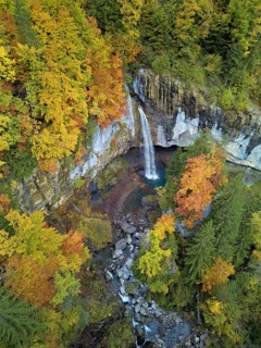 Aerial view of Berglistüber waterfall in autumn-colored surroundings, Linthal, Klausenpass, Canton